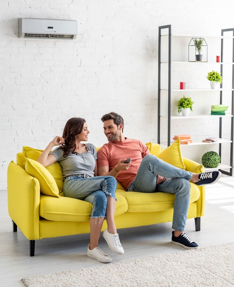 couple enjoying cool air from ac